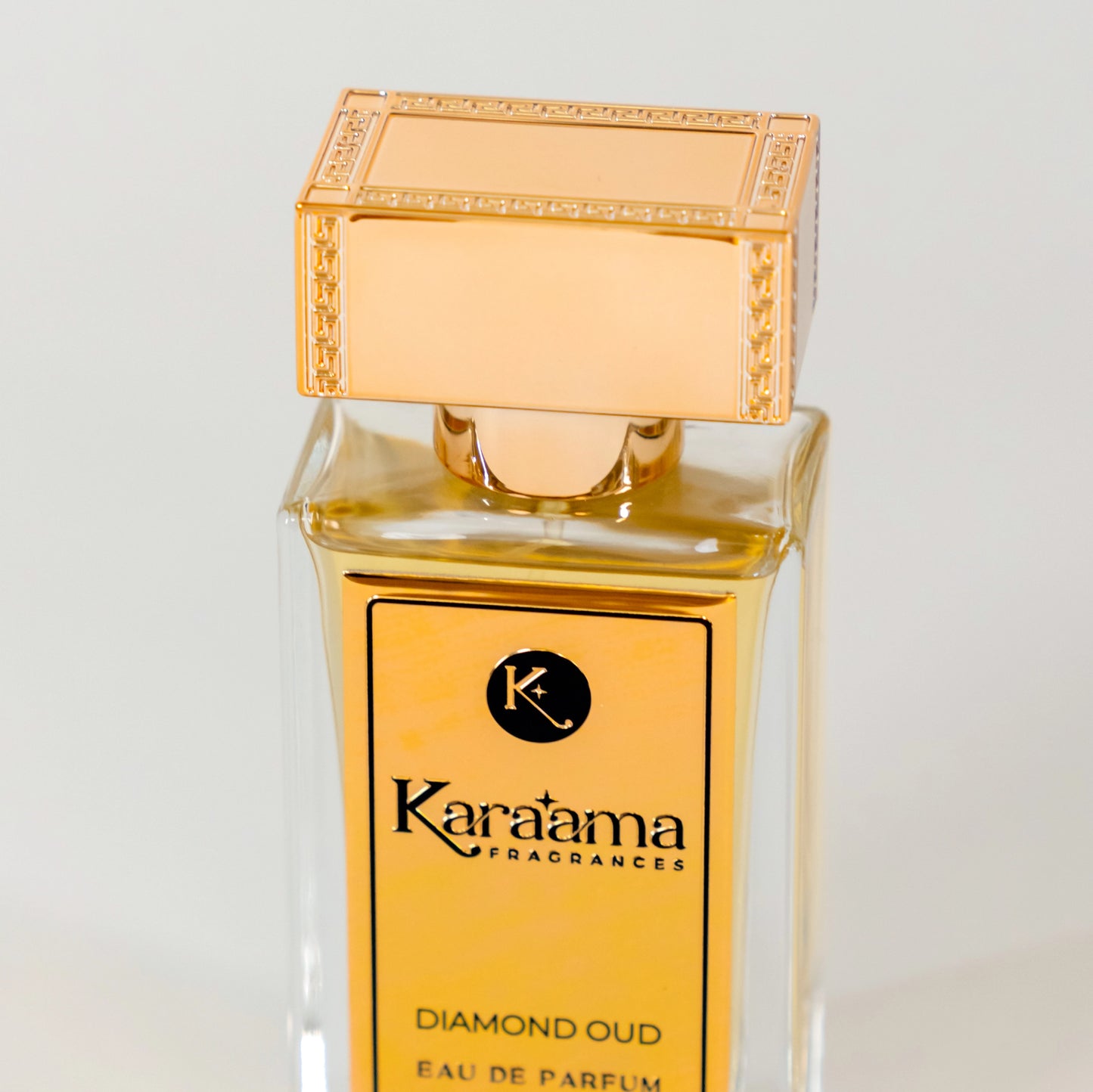 Elegant Karatama Diamond Oud Eau de Parfum bottle with ornate gold cap, a luxurious and trending fragrance choice. Perfect for enhancing style and sophistication. #LuxuryPerfume #EauDeParfum #Karatama #TrendingFragrance #StyleAccessorizing