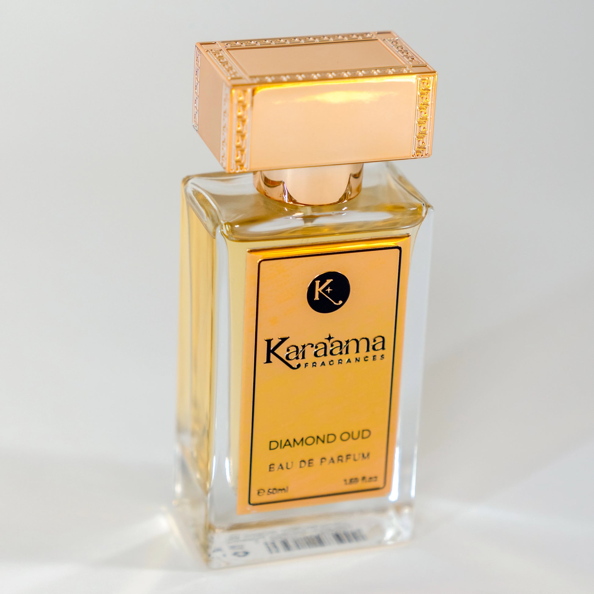 Elegant Diamond Oud Eau de Parfum by Karama Fragrances, featuring a luxurious design with a golden cap. A trending choice for scent enthusiasts.