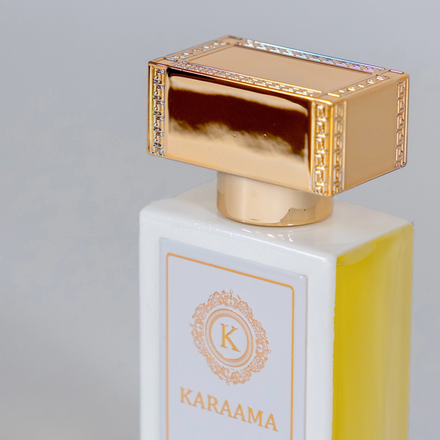 Elegant perfume bottle with golden cap and crystal details, showcasing the luxurious KARAAMA label, set against a soft, neutral background. Perfect for both personal indulgence and a sophisticated gift. #LuxuryPerfume #EleganceInABottle #FragranceTrend #DesignerScents #GiftIdeas