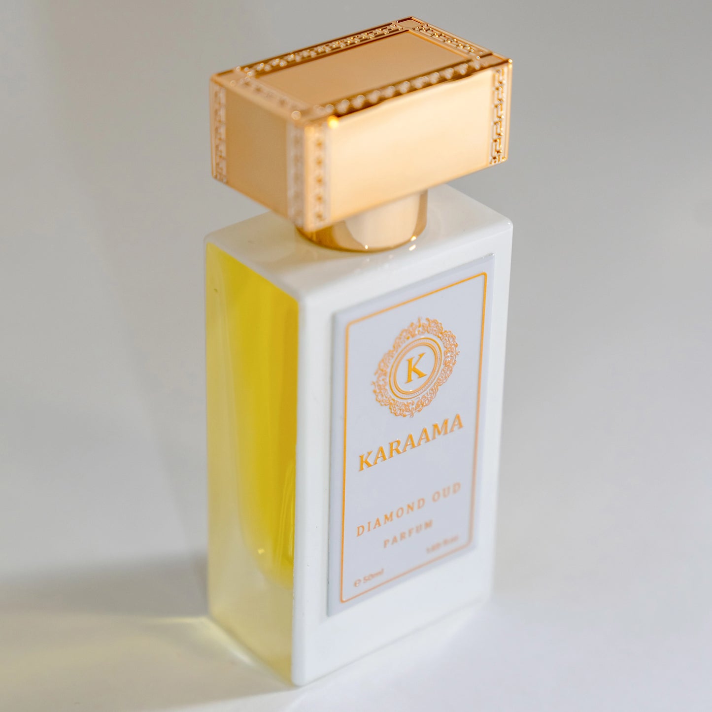 Elegant KARAAMA Diamond Oud perfume bottle with a luxurious gold cap, showcasing an exquisite, trending fragrance. Perfect for scent enthusiasts seeking a popular, professional appeal. #LuxuryFragrance #Perfume #TrendingScent #EleganceInABottle