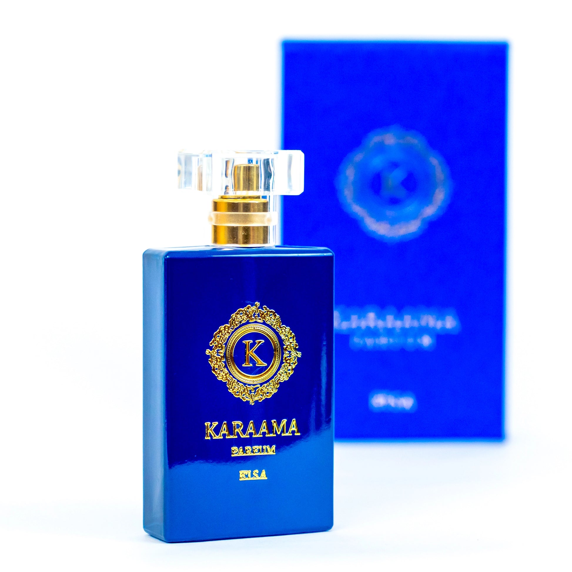Elegant blue perfume bottle with intricate gold detailing, labeled KARAAMA, set against a matching box on a white background—a symbol of luxury and sophistication. #Perfume #LuxuryFragrance #Elegance #BeautyProduct #TrendingAccessories