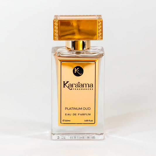 A bottle of Karaama Platinum Oud Eau de Parfum with a gold lid on a white table. The bottle is 50ml or 1.69 fl oz. [karaama.com]